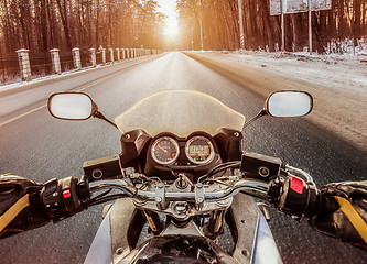 Image showing Biker First-person view. Winter slippery road