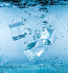 Image showing Ice cubes falling under water