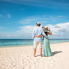 Image showing Vacation Couple walking on tropical beach Maldives.