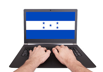 Image showing Hands working on laptop, Honduras