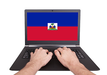 Image showing Hands working on laptop, Haiti