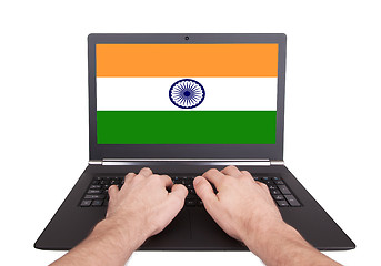 Image showing Hands working on laptop, India