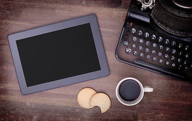 Image showing Tablet touch computer gadget on wooden table