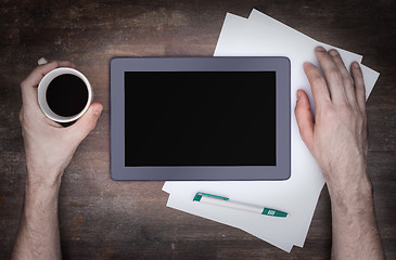 Image showing Tablet touch computer gadget on wooden table