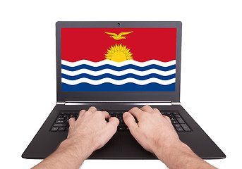 Image showing Hands working on laptop, Kiribati