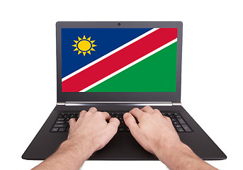 Image showing Hands working on laptop, Namibia