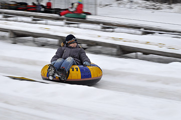 Image showing The boy rides the route for a snoutyubing.