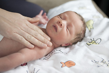 Image showing infant being caressed