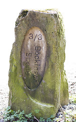 Image showing old boundary stone in white background