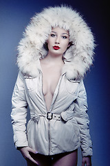 Image showing attractive beautiful girl in winter jacket with fur