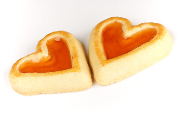 Image showing Two heart shaped apricot jam biscuits
