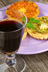 Image showing Mini vegetarian quiches and red wine