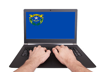 Image showing Hands working on laptop, Nevada