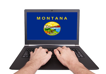 Image showing Hands working on laptop, Montana