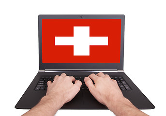 Image showing Hands working on laptop, Switzerland