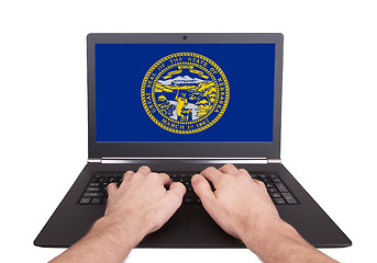 Image showing Hands working on laptop, Nebraska