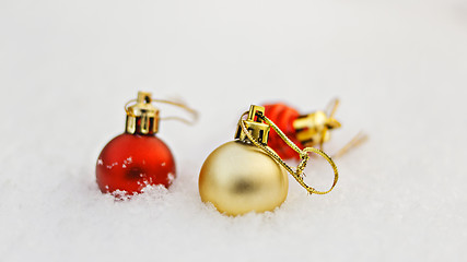 Image showing New year decoration balls on white snow