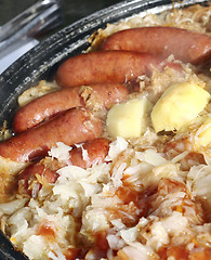 Image showing Smoked  sausage with stewed cabbage