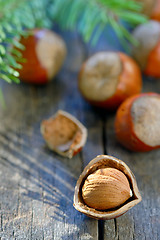 Image showing Whole Hazelnuts on old table