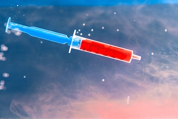 Image showing Syringe with red blood 