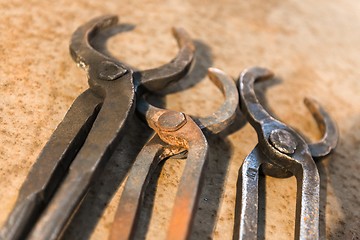 Image showing Old tools on rusty steel