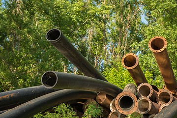 Image showing Rusty metal pipes in the forest