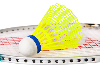 Image showing Shuttlecock lying on the badminton racket