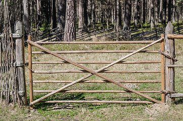 Image showing Wooden fence in the spring in the countryside