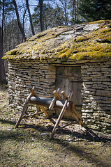 Image showing Old rural building with a roof covered by straw, close-up
