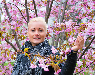 Image showing Portrait of a woman with sakura flowers