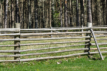 Image showing Wooden fence in the spring in the countryside