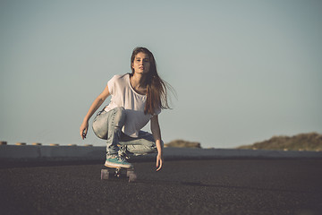 Image showing Skater girl making dowhill