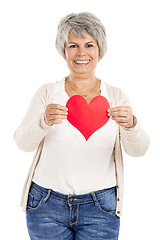 Image showing Holding a heart in her hands