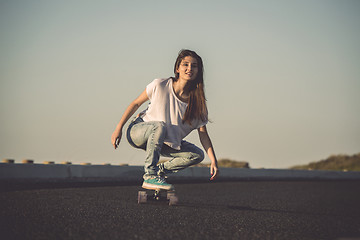 Image showing Skater girl making dowhill