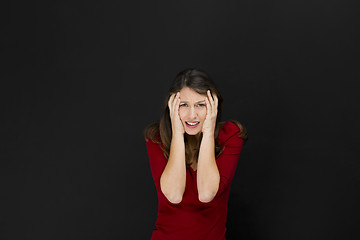 Image showing Beautiful female student with a headache