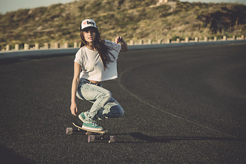 Image showing Skater girl making dowhill