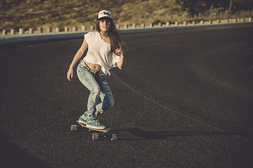 Image showing Skater girl making dowhill