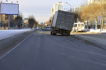 Image showing Accident. The truck with the spoiled wheel costs in the middle o