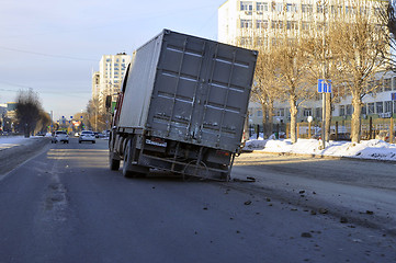 Image showing Accident. The truck with the spoiled wheel costs in the middle o