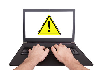 Image showing Man working on laptop, danger