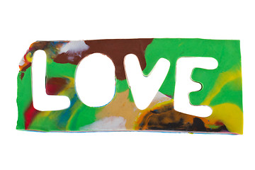 Image showing Plasticine letters forming word LOVE written on white background