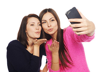 Image showing Two girls friends taking selfie with smartphone