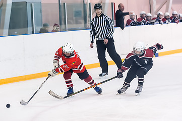 Image showing Game moment of children ice-hockey teams