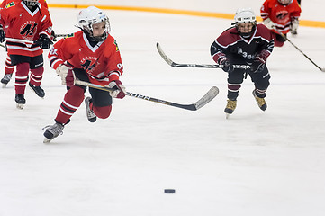 Image showing Game moment of children ice-hockey teams