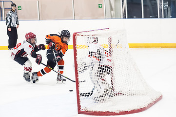 Image showing Attack in game between children ice-hockey teams