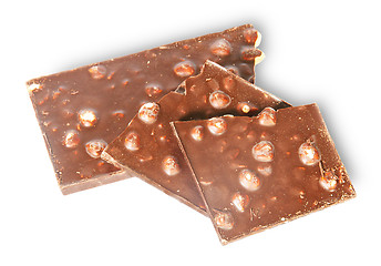 Image showing Pieces of dark chocolate with hazelnuts