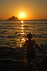 Image showing Kid playing on sunset on Itaipu Beach