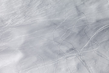 Image showing Off-piste slope with traces of skis and snowboarding