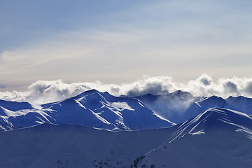 Image showing Evening winter mountains and sunlight clouds