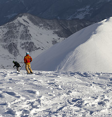 Image showing Freeriders on off-piste slope in sun nice evening